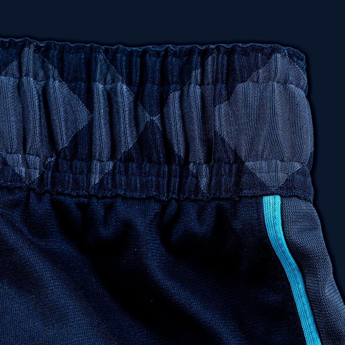 Each square of the waistband represents the growth of Oklahoma communities. As each community expands outward, they meet one another, merge, and blend into oneunified pattern inspired by ceremonial regalia.