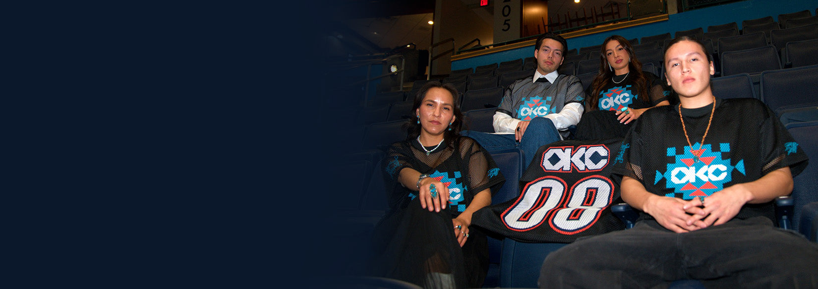 People sitting in a stadium with OKC merchandise