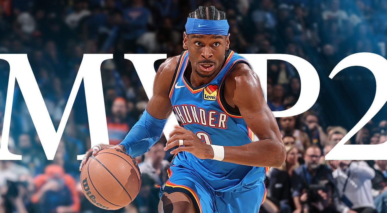 Basketball player in blue uniform holding a ball with 'MVP2' text in the background