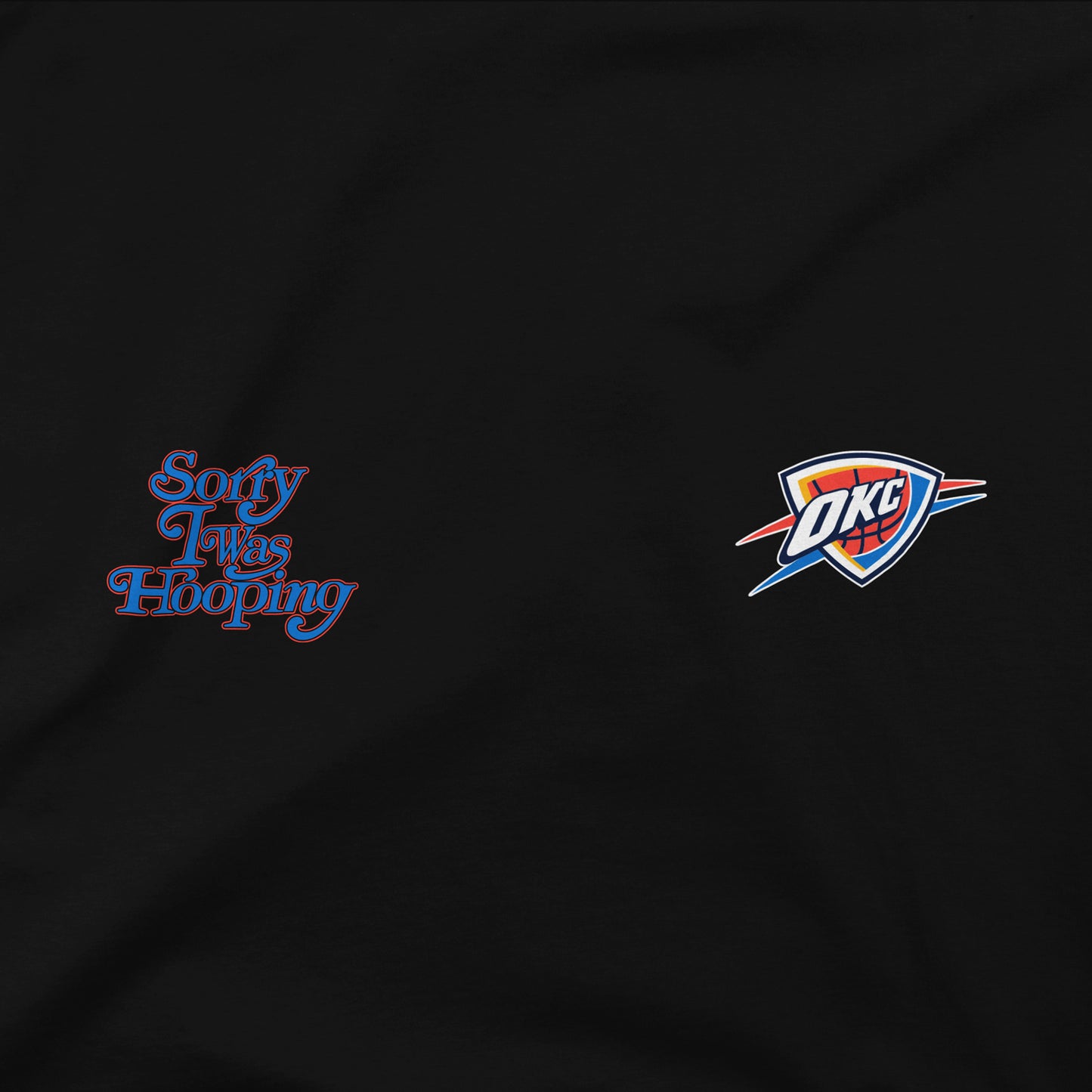 OKC THUNDER STADIUM ESSENTIALS 2025 SORRY I WAS HOOPING T-SHIRT in Black - Front Graphic View