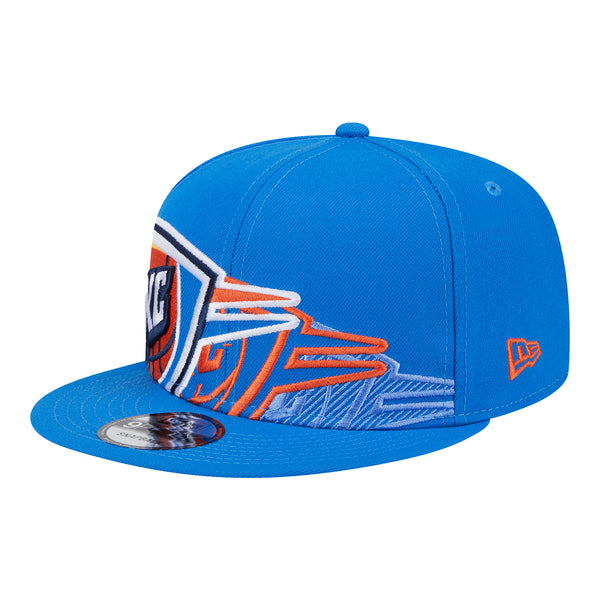 YOUTH OKC THUNDER NEW ERA 950 SHADOW LOGO SNAPBACK IN BLUE - FRONT LEFT VIEW