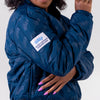 LADIES OKC PUFFER JACKET IN BLUE - RIGHT SHOULDER VIEW ON MODEL